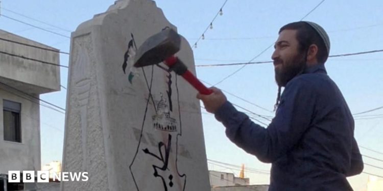 Far-right Israeli lawmaker damages Palestinian memorial with sledgehammer Far-right Israeli lawmaker damages Palestinian memorial with sledgehammer