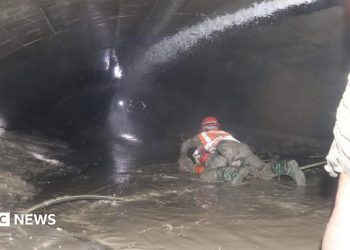 Nepal rescuers try to reach dozens trapped in tunnel after two pulled out alive